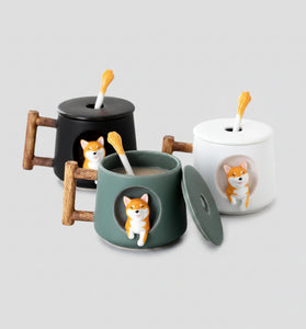 Set of ceramic mugs with dog designs on a table