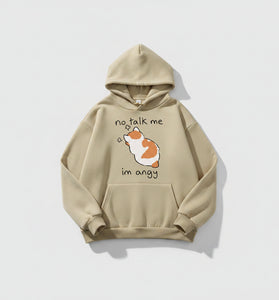 Beige hoodie with a cartoon dog and text on a casual setting