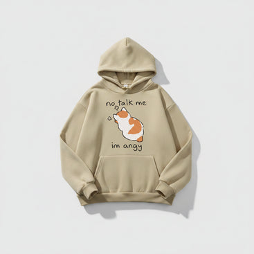 Beige hoodie with a cartoon dog and text on a casual setting