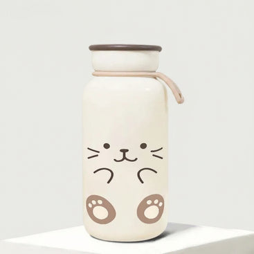 Cute water bottle with cat face design on a plain background