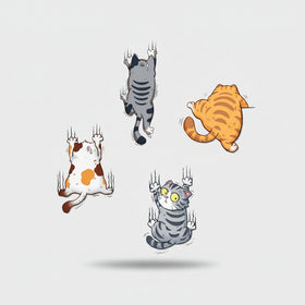 Wall stickers of cartoon cats on a wall in a room with a child's play area.
