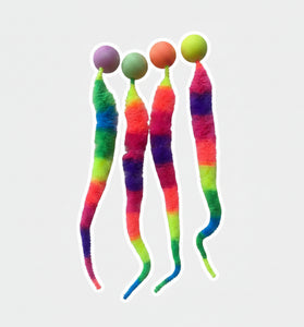 Colorful striped cat toys with pom-pom ends on a white background