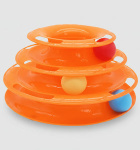 Orange plastic toy with three levels and colorful balls on a white background