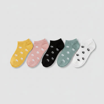 Four pairs of socks in yellow, black, gray, and pink with paw prints on a white background.