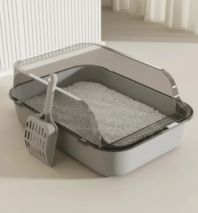 Cat litter box with dimensions and a scoop on a light background