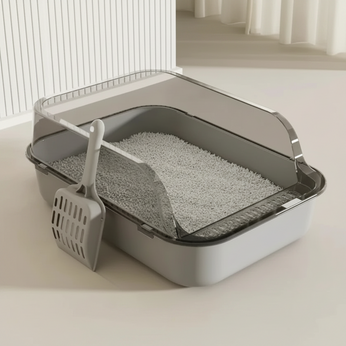 Cat litter box with dimensions and a scoop on a light background