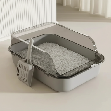 Cat litter box with dimensions and a scoop on a light background