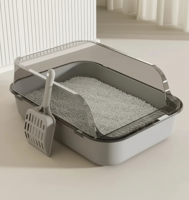 Cat litter box with dimensions and a scoop on a light background