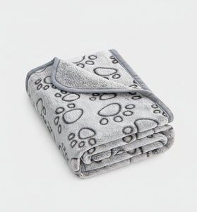 Gray blanket with paw prints on a white background