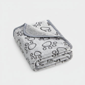 Gray blanket with paw prints on a white background