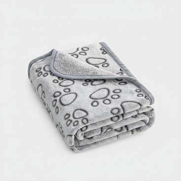 Gray blanket with paw prints on a white background