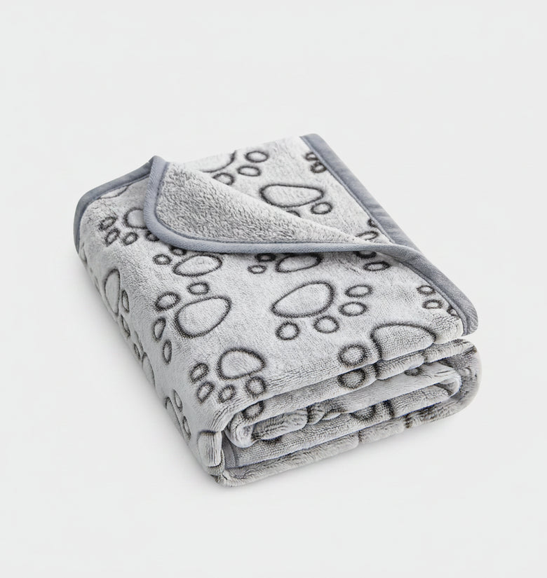 Gray blanket with paw prints on a white background