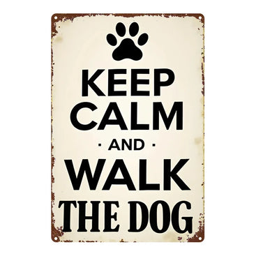 Vintage-style metal sign with paw print and text 'Keep Calm and Walk the Dog' on a white background.
