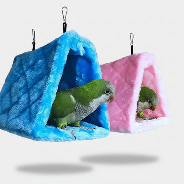 Two parrots in colorful bird nests with text 'Bird Cages & Nests'.